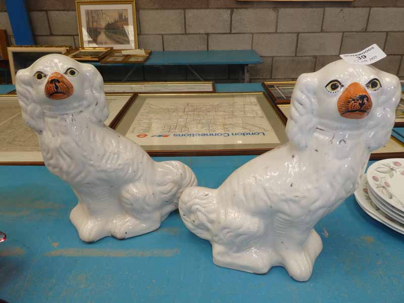 A pair of staffordshire pottery fireside dogs