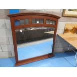A large arch top overmantle mirror with gloss frieze above large bevelled glass mirror