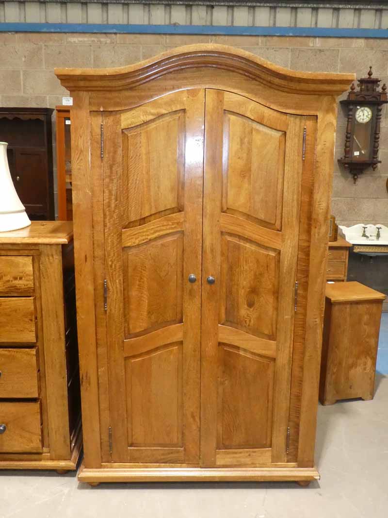 A fruitwood armoire, two door with three interior shelves