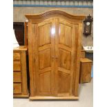 A fruitwood armoire, two door with three interior shelves
