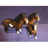 Two Beswck pottery brown Shetland ponies and a foal