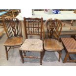 A pair of 19th Century wheel back Windsor chairs and a Yorkshire spindle back rush seat chair