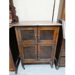 An oak four door cabinet