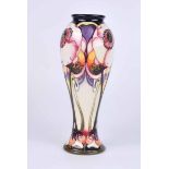 A Moorcroft tall slender baluster vase in the Emma pattern by Emma Bossons, dated 2006 to the base