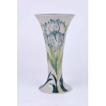 A Moorcroft slender tapering cylindrical vase in the Green Iris pattern, 2013 Centennial Relaunch of