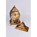 A modern French style two train bracket clock with pink foliate decorated patinated gold coloured