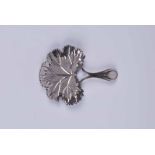 A George III neoclassical silver caddy spoon of shallow leaf form and with Cameo and harebell