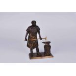 A 19th Century parcel gilt bronze cast iron figure group of blacksmith at his anvil, unsigned 20cm