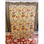 An early 20th Century three fold modesty screen upholstered in paisley style print fabric