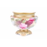 A Royal Worcester small rose bowl with hand painted bud and bloom decoration and date marks to the