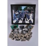 A collection of Beatles memorabilia including 31 facsimile signed A&BC gum cards, singles of