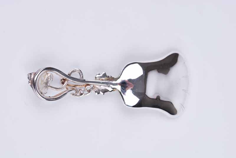 A modern silver caddy spoon with trailing vine tendril handle and grape and vine decorated bowl, - Image 3 of 3