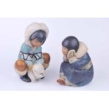 A Lladro figure 'Poor Little Bear' of an inuit girl with polar bear cub 21 cm H together with a