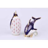 A Royal Crown Derby dolphin paperweight together with a further penguin example (2)