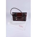 A Tula vintage crocodile skin handbag with turquise lining, complete with original dust bag