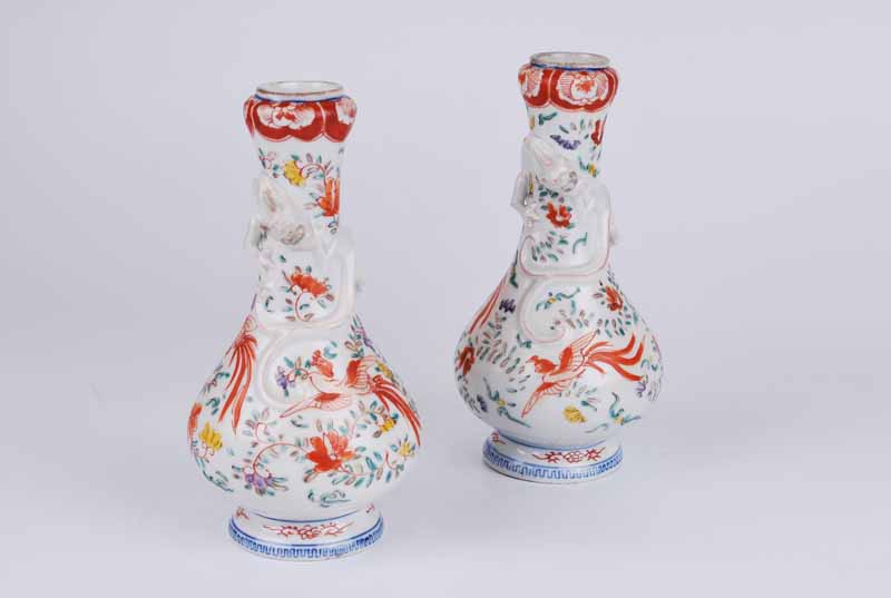 A pair of 19th Century Chinese porcelain Wucai footed gourd vases with applied kylin winding