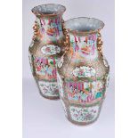 A pair of 19th century Canton enamel famille rose baluster vases, with pleated rim and segmented