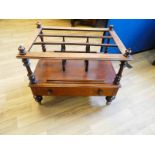 A Victorian walnut canterbury with four pillar top on single drawer base surmounting turned legs