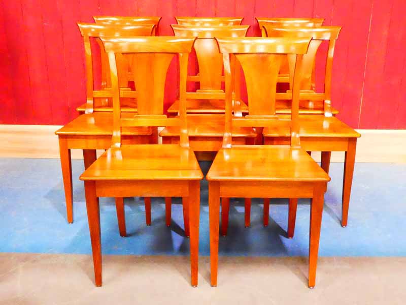 A set of eight walnut Biedermeier dining chairs with flared splat 90cm H