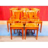 A set of eight walnut Biedermeier dining chairs with flared splat 90cm H