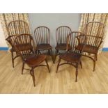 Six reproduction hand made Windsor chairs with elm seats and crinoline stretchers. Four chairs and 2