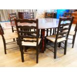 A set of eight oak Lancashire ladderback dining chairs, typical form with rush seat, turned front
