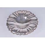 An 800 grade silver dish, possibly Italian, with fluted bowl and scrolling acanthus edge 27 cm