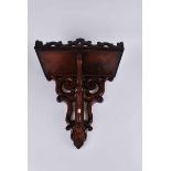 A good Victorian mahogany clock bracket, with pierced gallery and on s scroll supports 50cm High