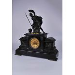 An architectural black slate mantle clock with parcel gilt bronze female warrior figure with