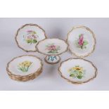 A Victorian Mintons hand painted botanical dessert service, comprising tazza, a pair of tazzae,