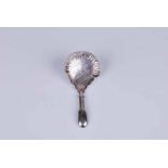 A Regency silver caddy spoon with hollow handle and brightcut guilloche decoration in the serpentine