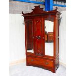 A Victorian mahogany single wardrobe with later pagoda top