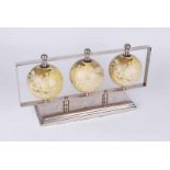 A set of three terrestrial globes mounted in chrome frame on socle base 40.5cm