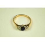 An 18 ct three stone sapphire and diamond ring, size R 1/2 3.1g