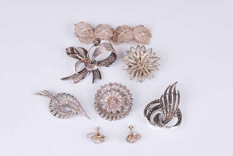 A small group of silver filigree and silver marcasite jewellery; to include brooches, earrings,