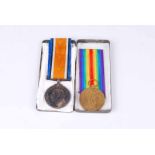 Great war pair of service and defence medals inscribed 76901 pte W.H Houghton Manch. R. With