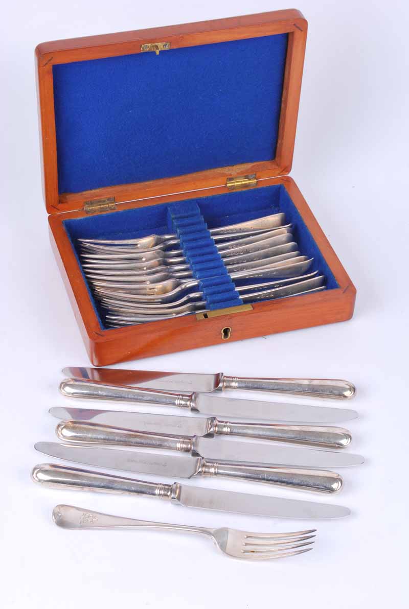 A CASED SET OF 12 Victorian silver starter forks, London 1882 by George Adams, 303g together with