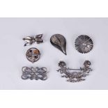 Six silver & white metal brooches