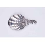 A modern rococo silver caddy spoon with C-scroll handle and scallop shell bowl, London 1983 and