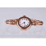 A lady's 9 ct gold wristwatch on 9 ct expanding strap, the white dial with Roman chapter ring, 25.