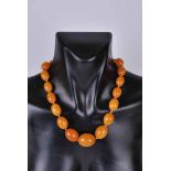 An early to mid-twentieth century amber bead necklace