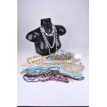 A good selection of mid to late 20th century costume jewellery to include paste necklaces, bead