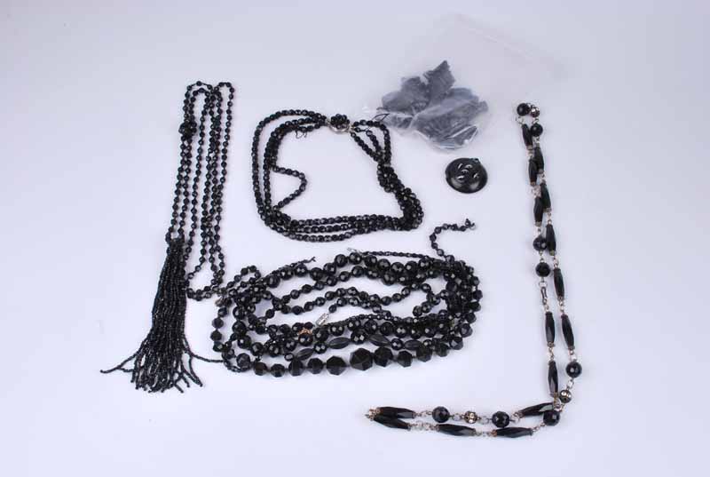 A collection of French jet faceted bead necklaces together with a small group of Whitby jet items (