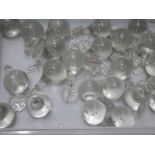 A tray of glass chandelier droppers.