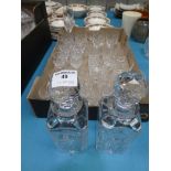 A pair of crystal glass decanters and 28 mixed crystal drinking glasses.