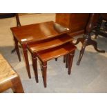 Early to mid century nest of three mahogany tables.