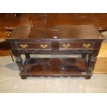 Early 20th century Jacobean revival oak sideboard/buffet with pot shelf base.