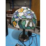 A modern Tiffany style table lamp with leaded mushroom shape shade.