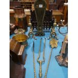 A cast iron fire basket,pair of brass fire dogs, brass fan spark guard and 3 fire irons.