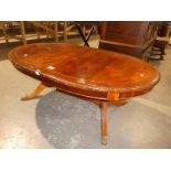 A reproduction D ended mahogany effect magazine table
